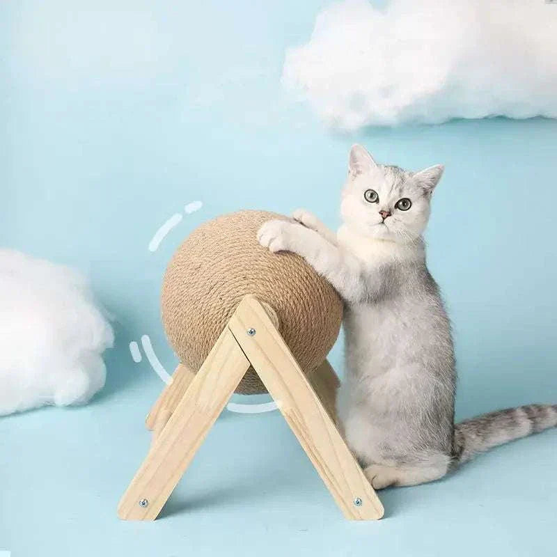 Cat playing with sisal rope ball scratching toy for indoor interactive fun.