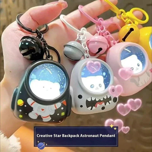 Glowing astronaut cat backpack keychain pendant with night light accessory, ideal for bags, cars, or gifts.