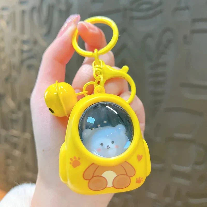 Yellow glowing astronaut cat backpack keychain pendant for bags and cars.