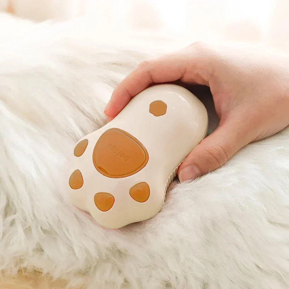 Cat paw shaped steam brush for 3-in-1 pet grooming.