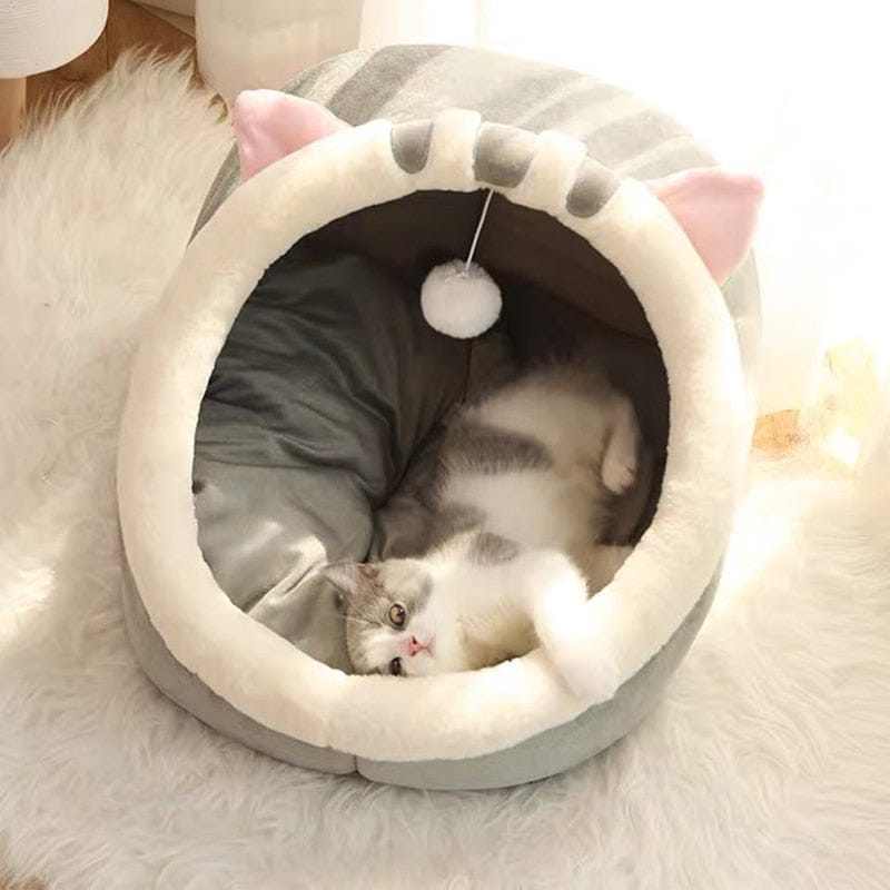 Animal shape cat bed with plush design and cat ears, perfect for warmth and comfort.