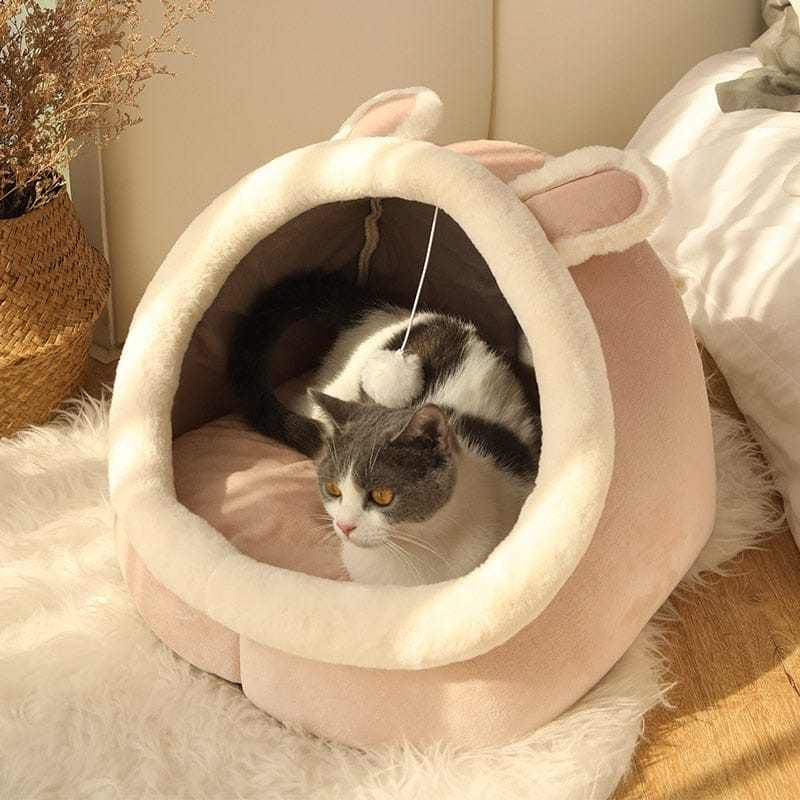 Animal shape cat bed with ears, cozy and semi-enclosed design.