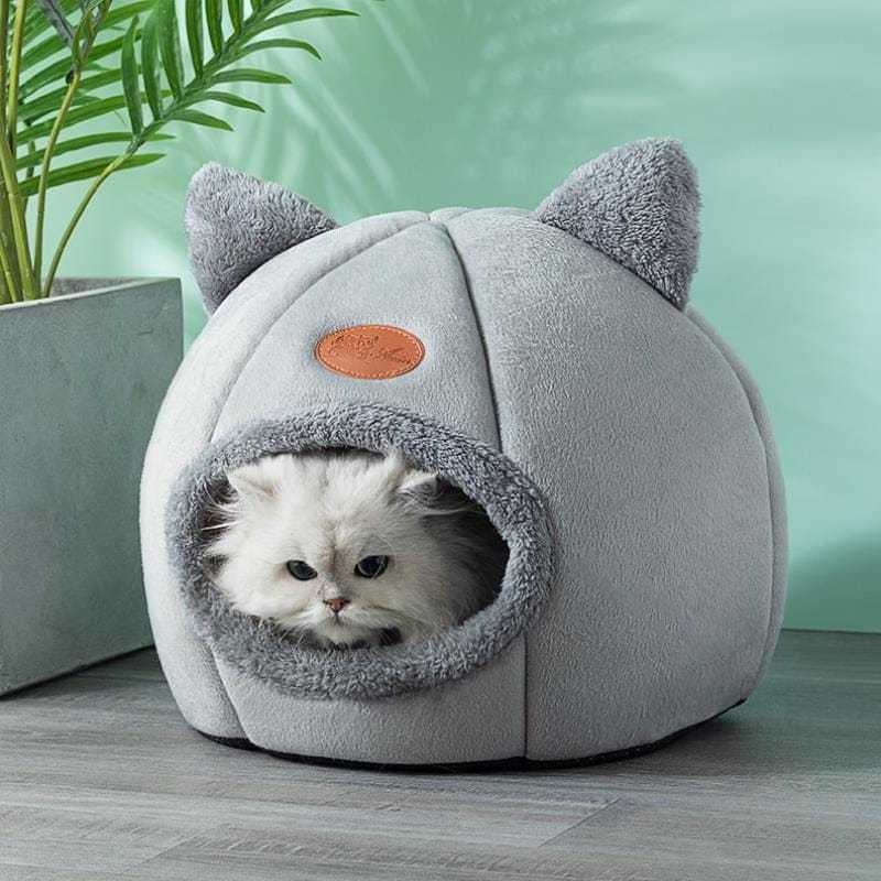 Cute Cat Cave with Removable Bed Cushion in gray, providing a cozy retreat for cats during winter.