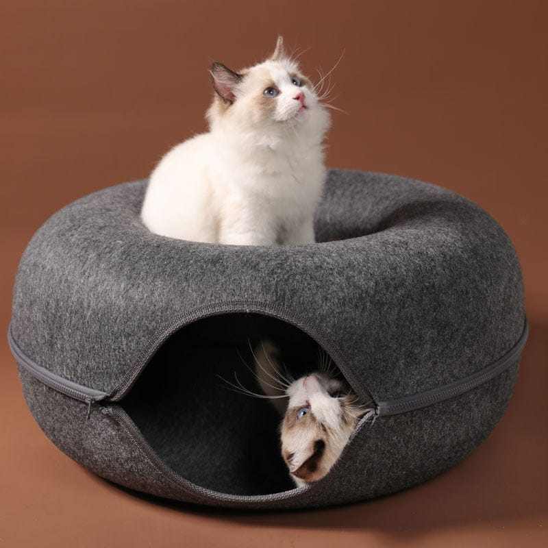 Donut shaped felt cave cat bed with a cozy, tunnel-like interior and a top hole entrance, perfect for reducing cat stress.