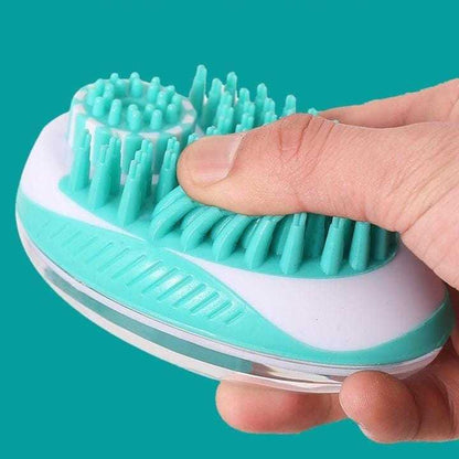 Soft silicone pet brush comb in hand, featuring ergonomic design with non-slip grip and foam reservoir for efficient grooming and bathing.